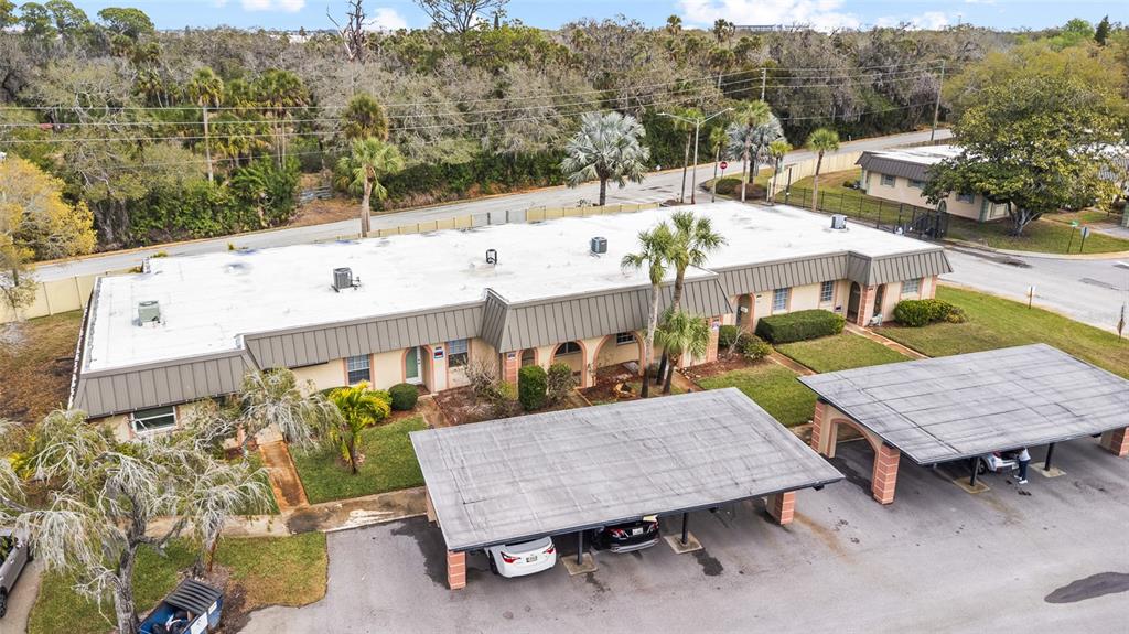 4467 Rustic Drive New Port Richey, FL 34652 - Photo 37 of 44 a view of a patio with furniture and a mountain