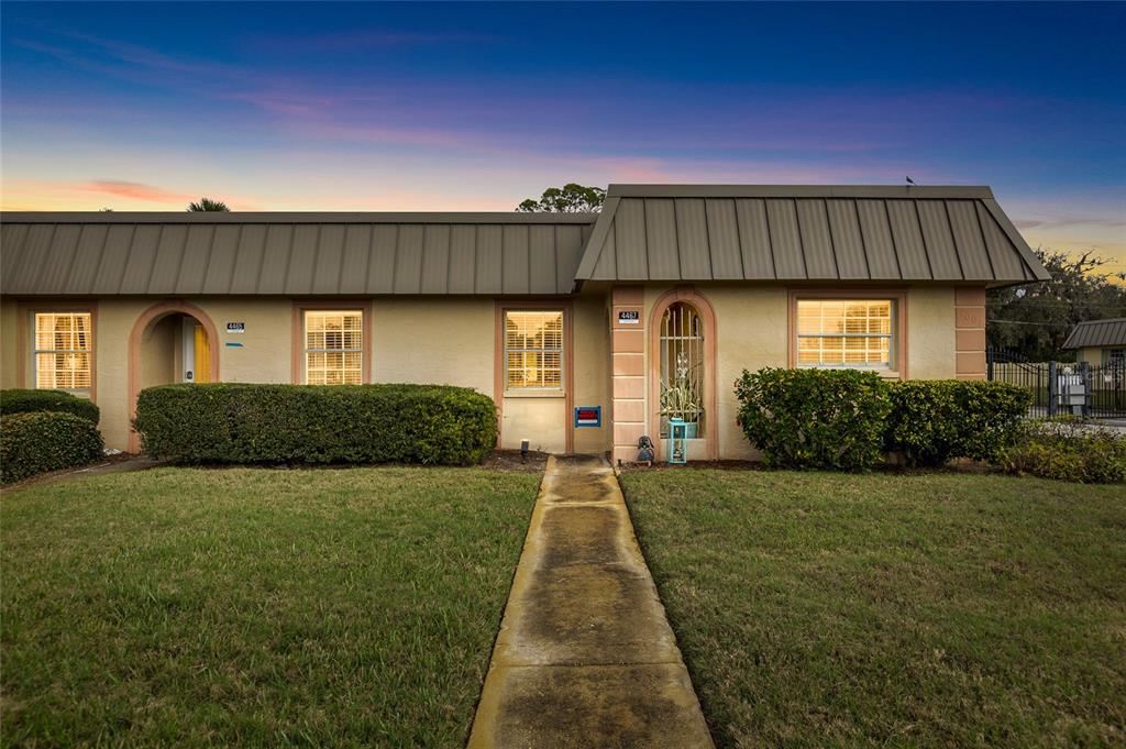 4467 Rustic Drive New Port Richey, FL 34652 - Photo 43 of 44 a front view of a house with a yard