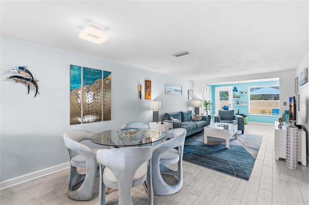 4467 Rustic Drive New Port Richey, FL 34652 - Photo 9 of 44 a view of a dining room with furniture window and wooden floor
