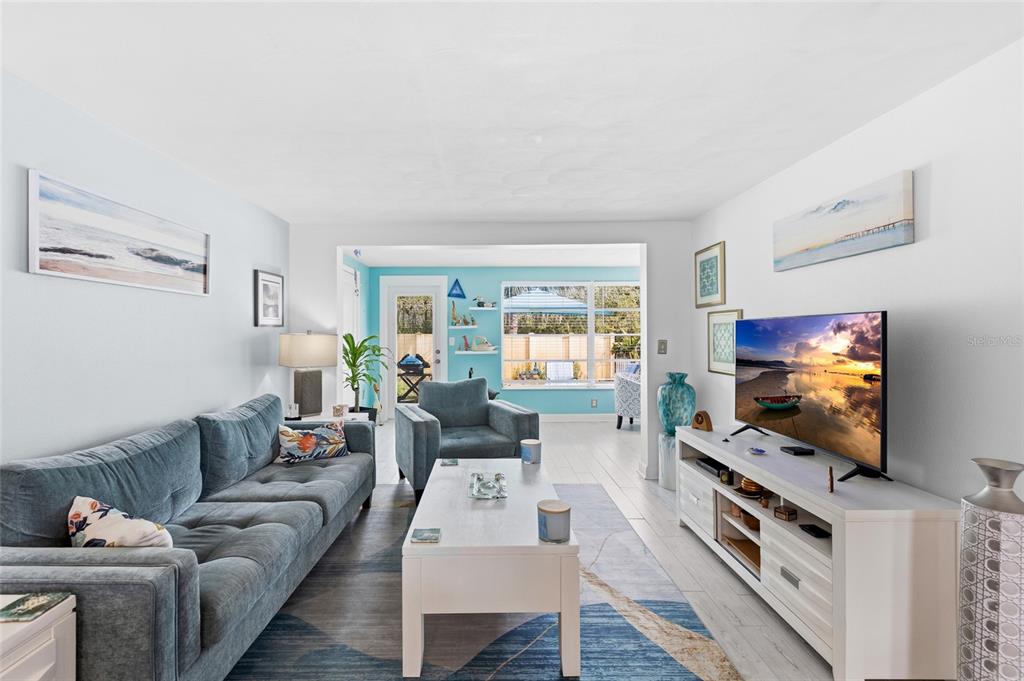 4467 Rustic Drive New Port Richey, FL 34652 - Photo 10 of 44 a living room with furniture and a flat screen tv