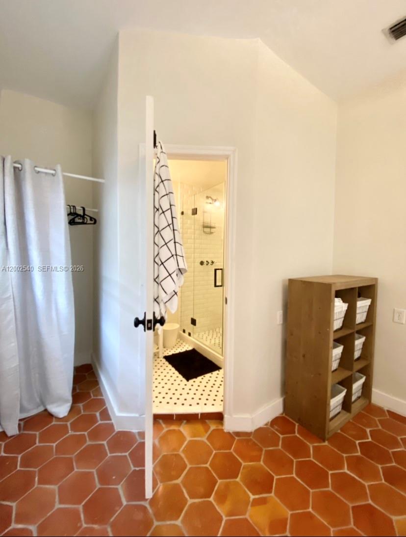 4619 Southwest 10th Street Miami, FL 33134 - Photo 12 of 30 a bathroom with a shower and a toilet