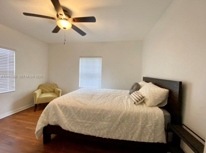 4619 Southwest 10th Street Miami, FL 33134 - Photo 18 of 30 a bedroom with a bed and a ceiling fan