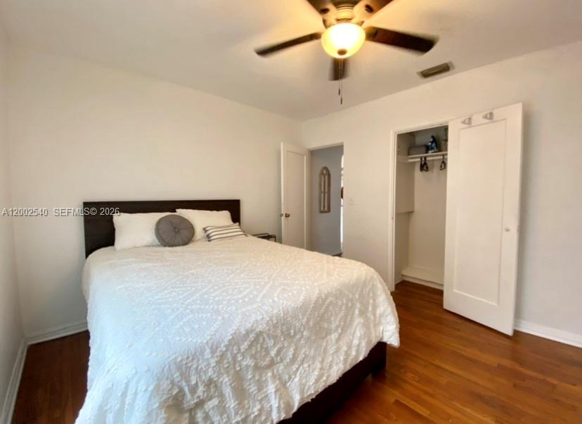 4619 Southwest 10th Street Miami, FL 33134 - Photo 19 of 30 a bedroom with bed and wooden floor