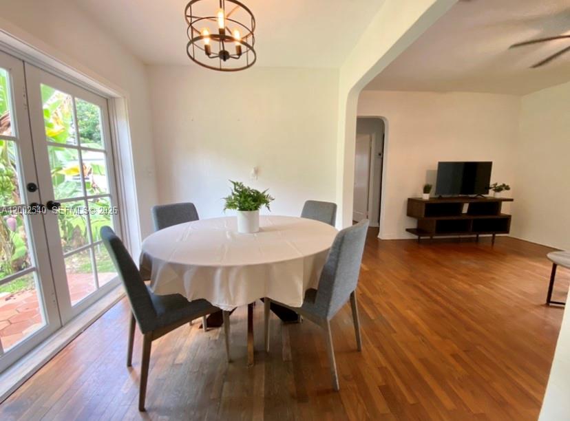 4619 Southwest 10th Street Miami, FL 33134 - Photo 2 of 30 a view of a dining room with furniture window and wooden floor