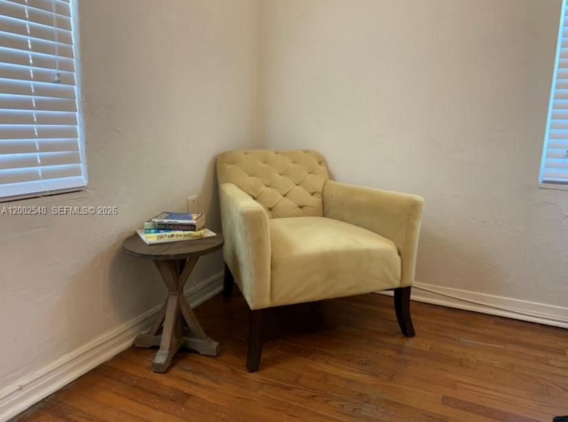 4619 Southwest 10th Street Miami, FL 33134 - Photo 21 of 30 a couch sitting in a room next to a window