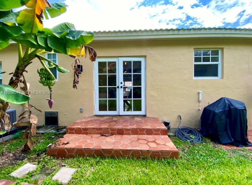 4619 Southwest 10th Street Miami, FL 33134 - Photo 26 of 30 a front view of a house with yard