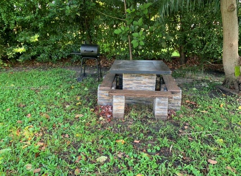 4619 Southwest 10th Street Miami, FL 33134 - Photo 27 of 30 a view of a garden with plants and large trees
