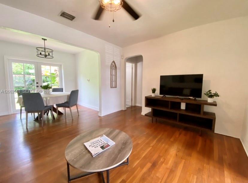 4619 Southwest 10th Street Miami, FL 33134 - Photo 6 of 30 a living room with furniture and a flat screen tv