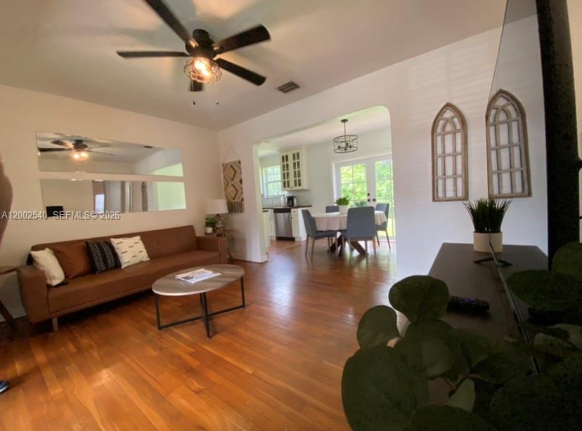 4619 Southwest 10th Street Miami, FL 33134 - Photo 7 of 30 a living room with fireplace furniture and a rug