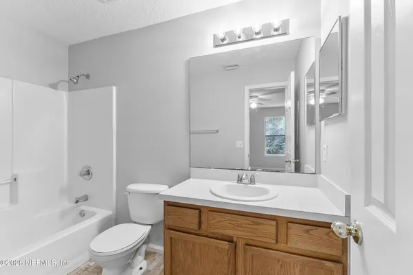 a bathroom with a sink toilet a shower and a mirror