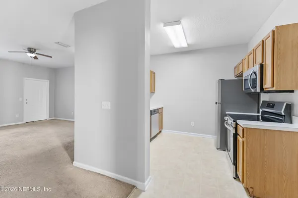 a view of a kitchen with a sink