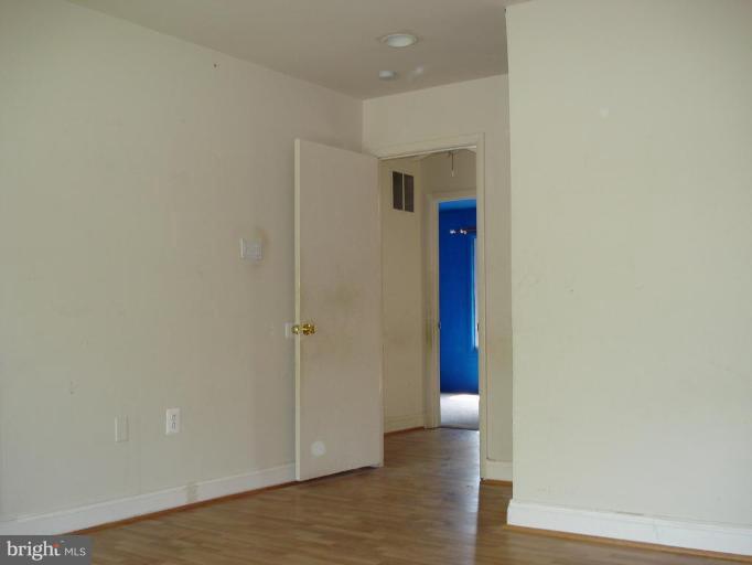 9072 Centerway Road Gaithersburg, MD 20879 - Photo 11 of 15 a view of a hallway with wooden floor