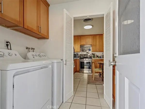 a kitchen with appliances cabinets and furniture