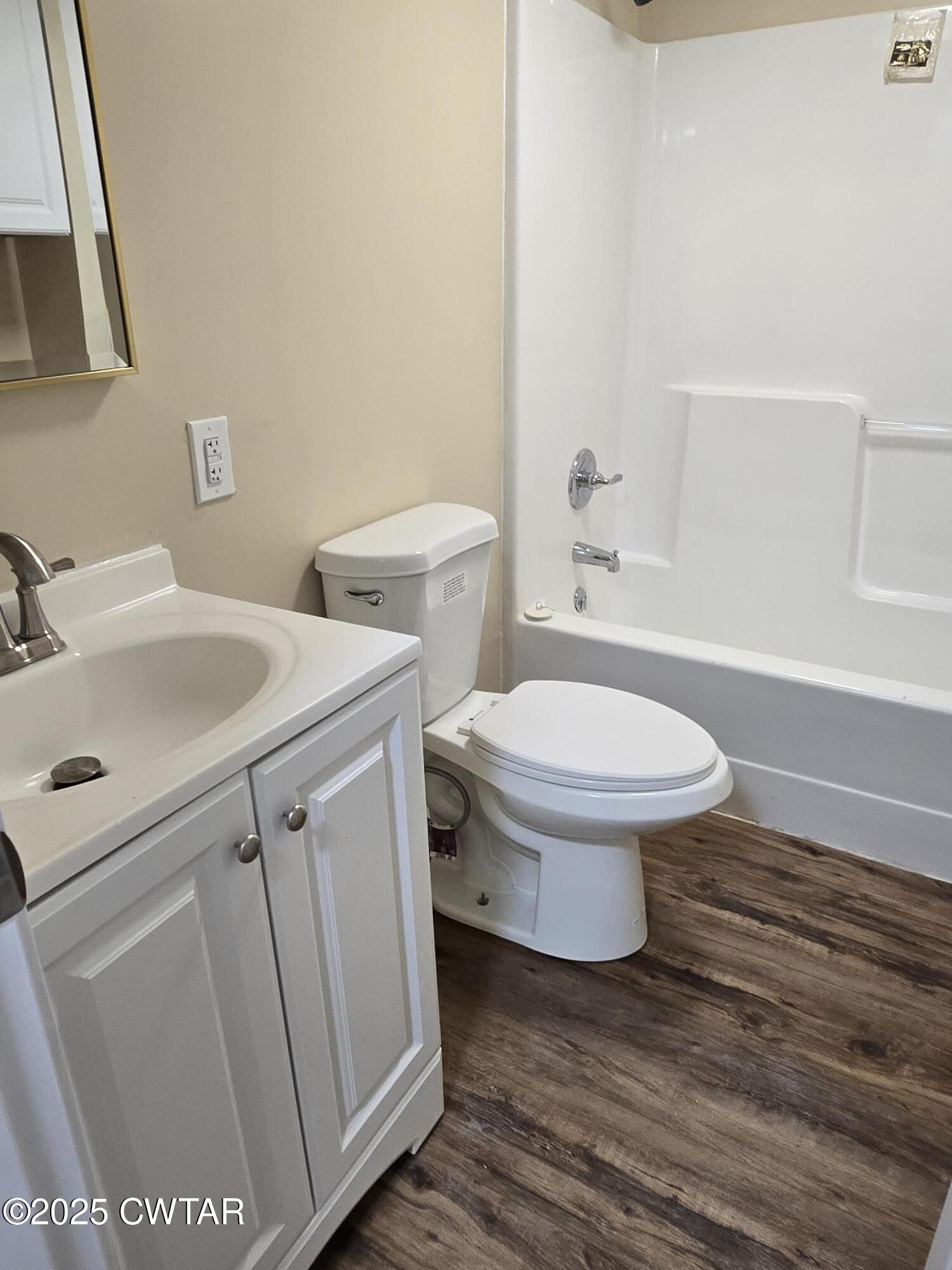 45 Lesters Chapel Road Jackson, TN 38301 - Photo 12 of 16 a bathroom with a sink toilet and vanity