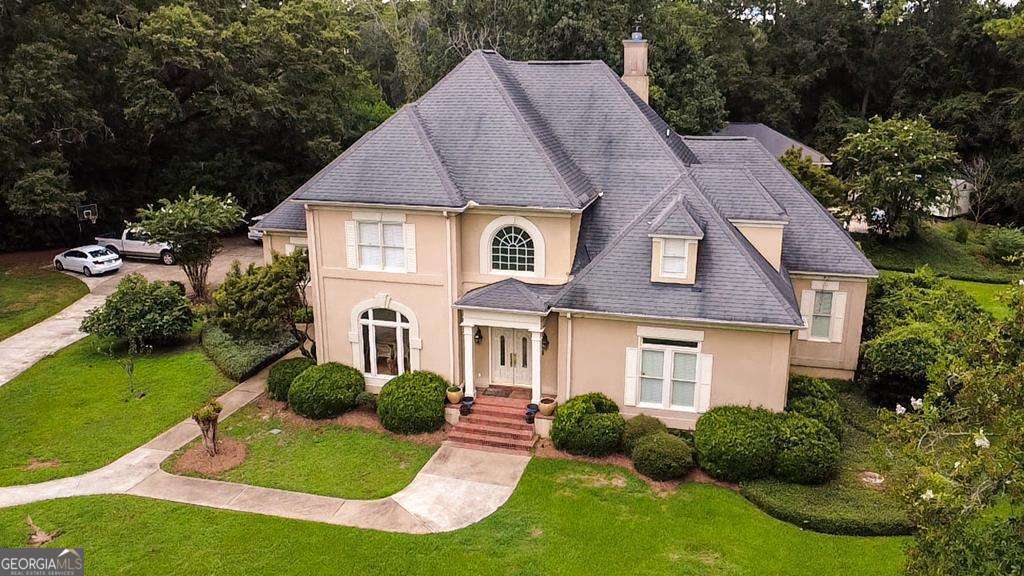 2115 Cumberland Lane Albany, GA 31707 - Photo 1 of 47 a front view of a house with garden