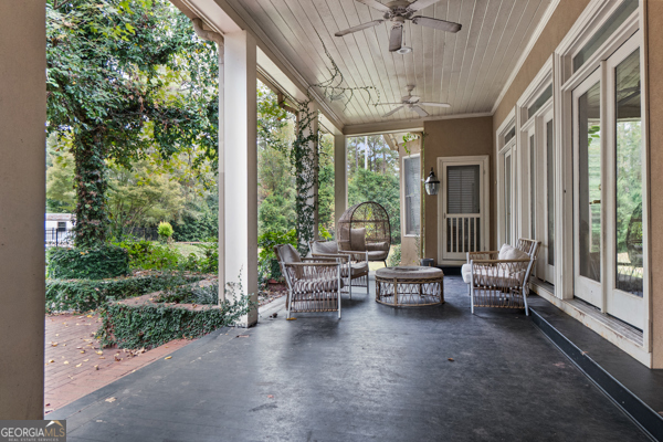 2115 Cumberland Lane Albany, GA 31707 - Photo 31 of 47 a view of a patio with chairs and floor to ceiling window