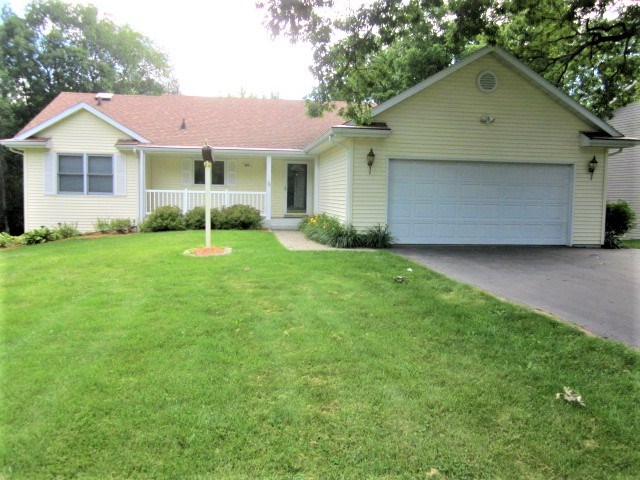 693 Lake Summerset Road Lake Summerset, IL 61019 - Photo 1 of 25 a front view of a house with a yard and garage