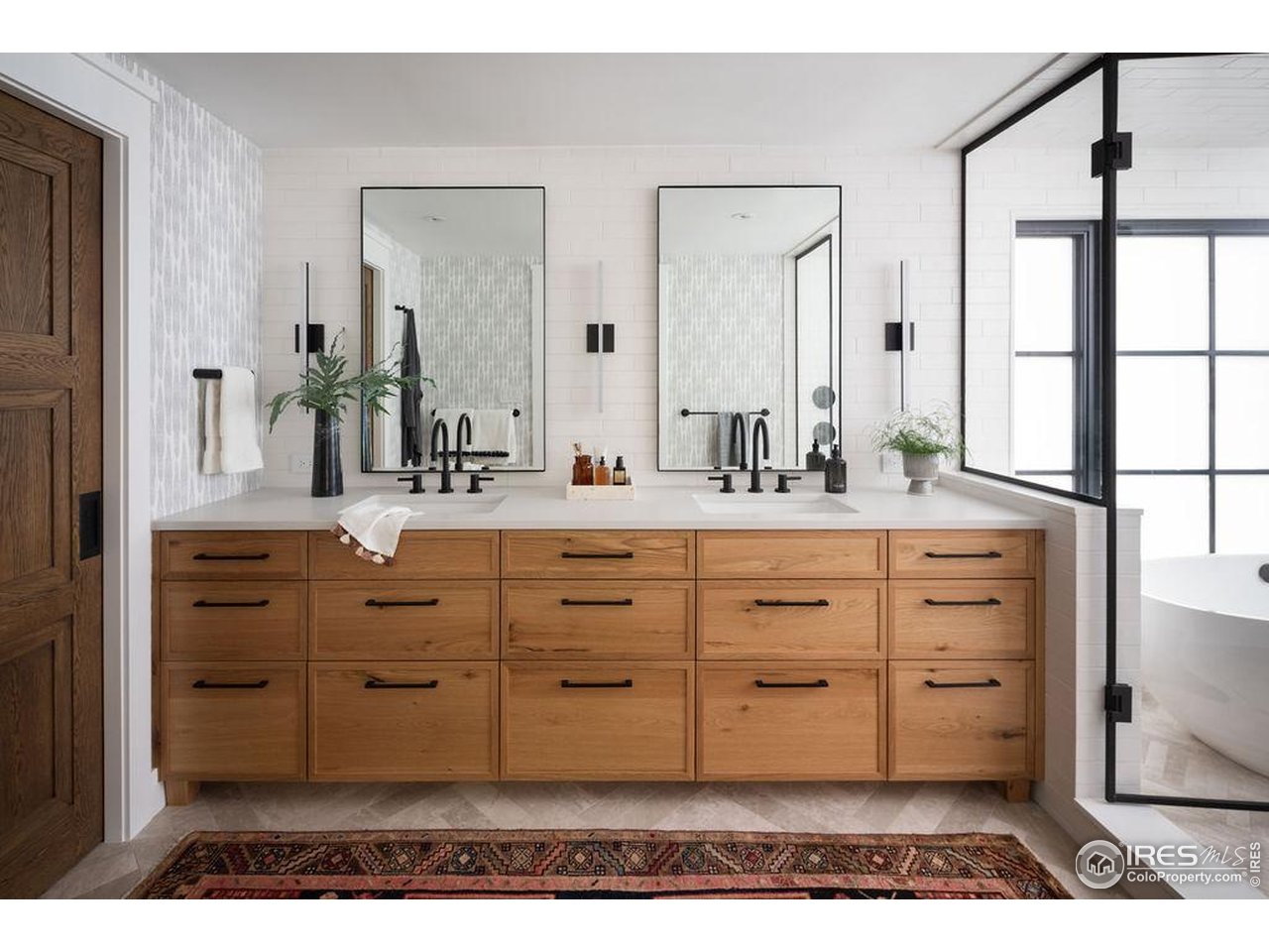 2828 4th Street Boulder, CO 80304 - Photo 13 of 30 a bathroom with a vanity sink and a mirror