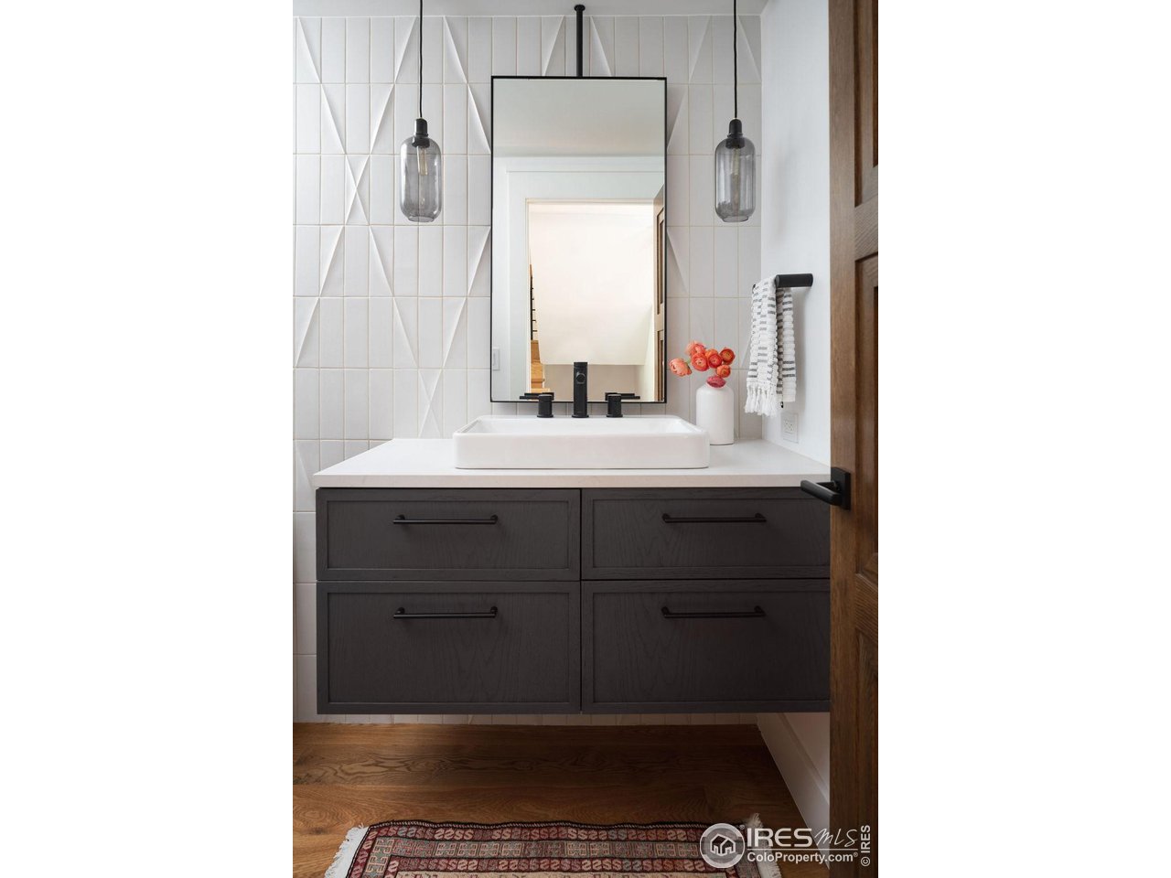 2828 4th Street Boulder, CO 80304 - Photo 20 of 30 a bathroom with a sink and a mirror