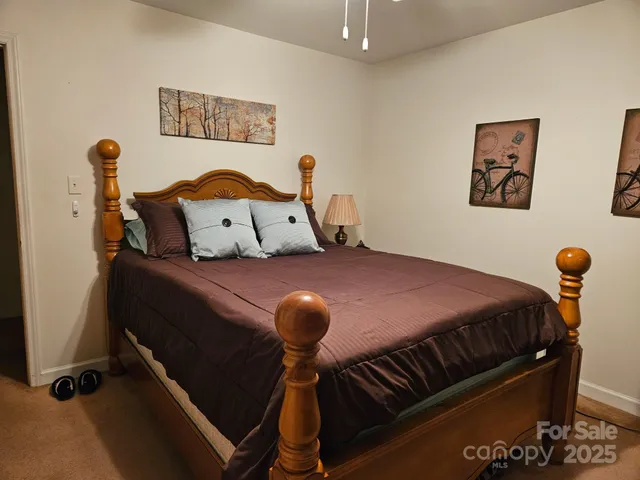 a bedroom with a bed and dresser