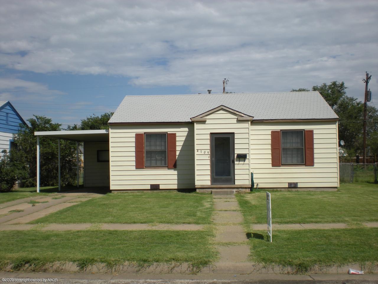 4109 Cline Road Amarillo, TX 79110 - Photo 1 of 11 a front view of a house with a yard