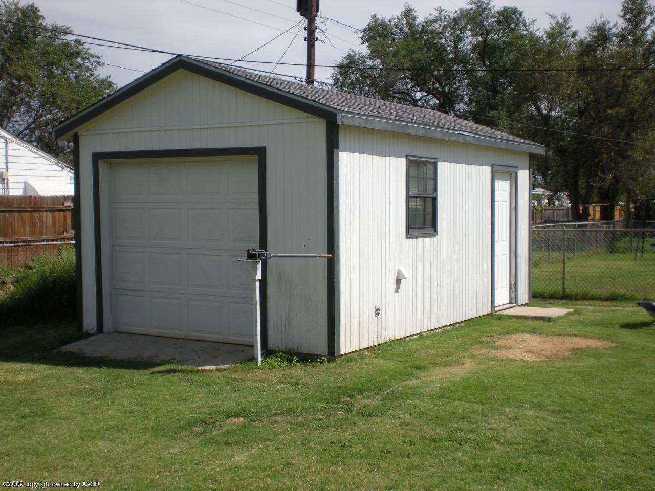 4109 Cline Road Amarillo, TX 79110 - Photo 11 of 11 a view of a small house with a yard