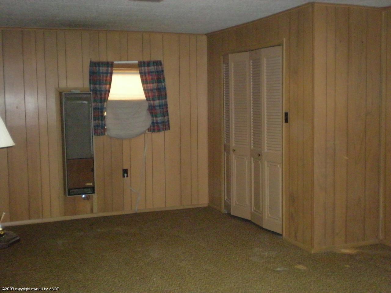 4109 Cline Road Amarillo, TX 79110 - Photo 5 of 11 a view of an empty room and wooden floor