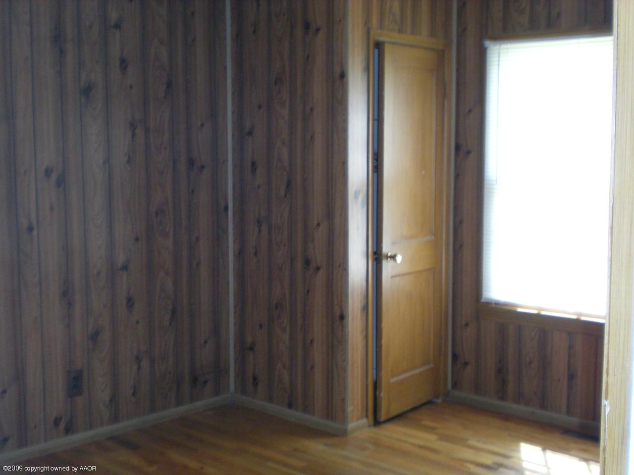 4109 Cline Road Amarillo, TX 79110 - Photo 6 of 11 a view of a hallway with wooden floor