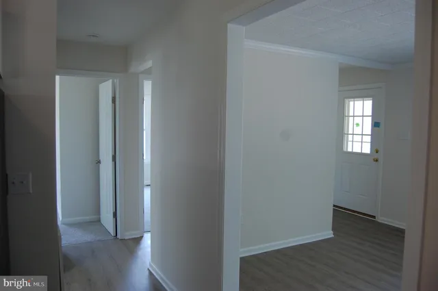 a view of hallway with windows