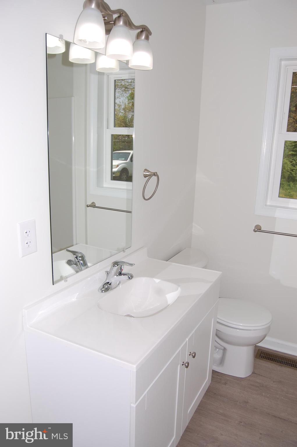 11511 Old School Road Mardela Springs, MD 21837 - Photo 22 of 34 a bathroom with a sink and a mirror