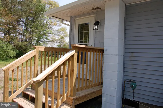 a view of staircase with wooden door