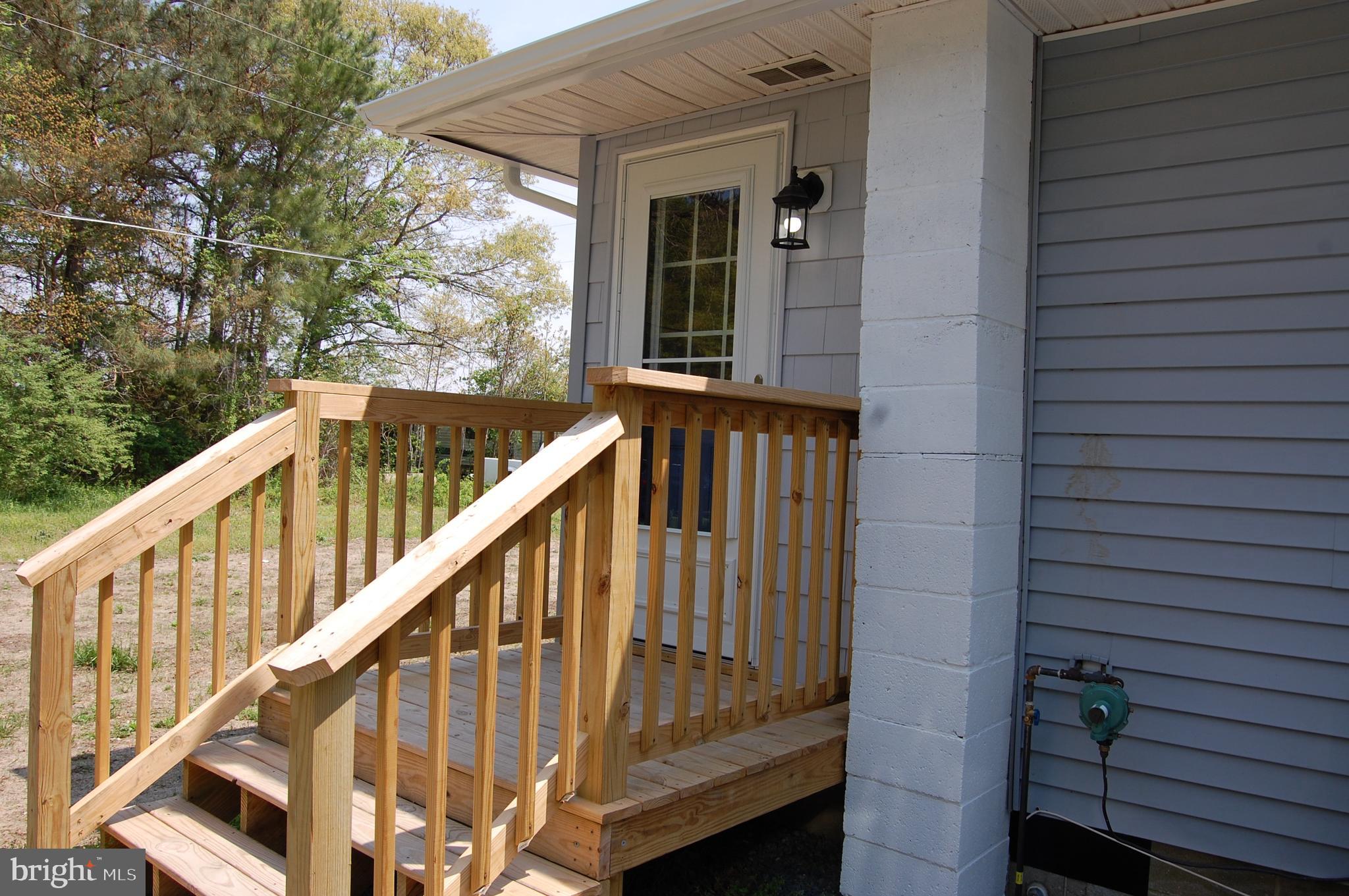 11511 Old School Road Mardela Springs, MD 21837 - Photo 30 of 34 a view of balcony with wooden floor and fence
