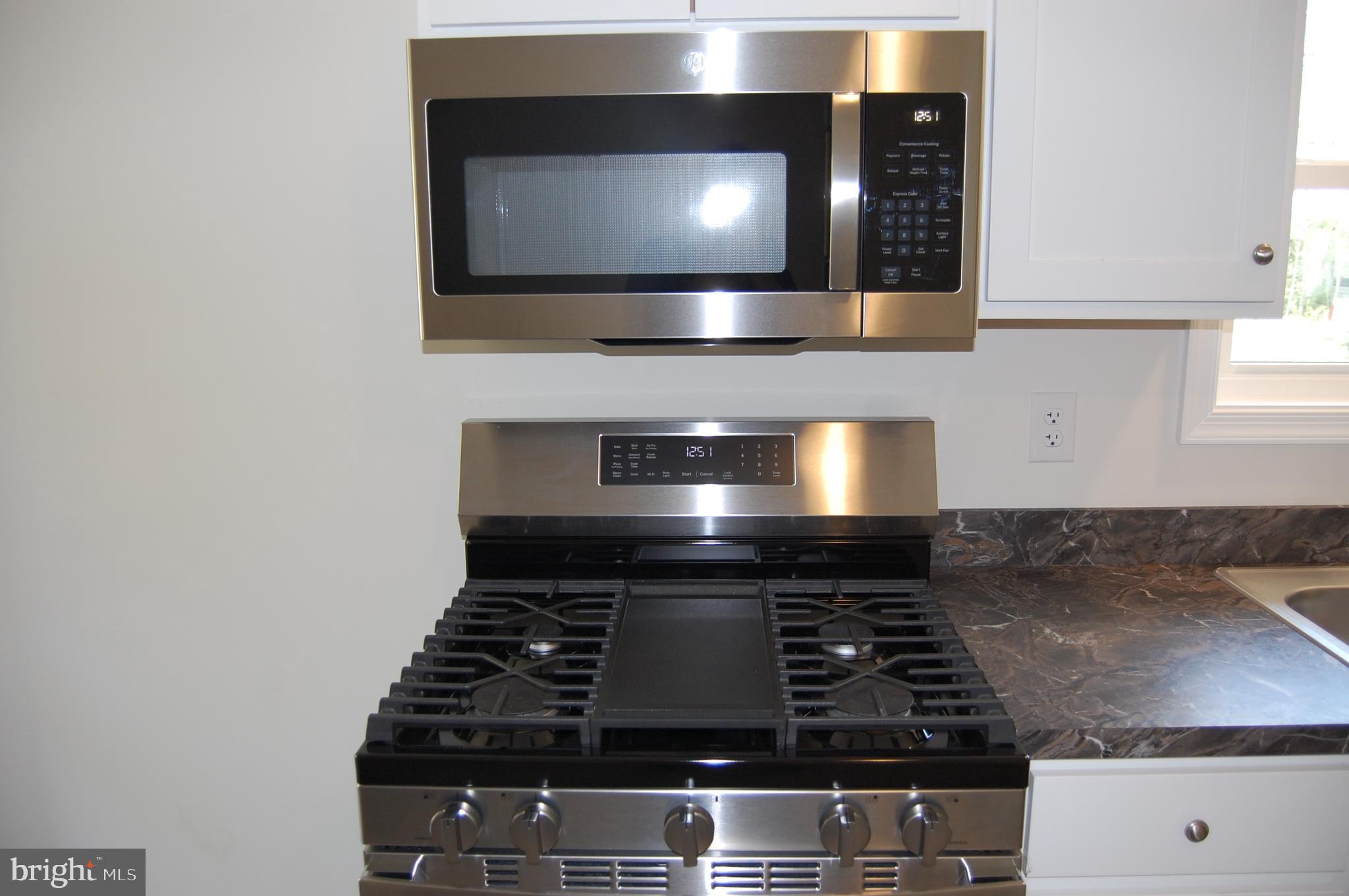 11511 Old School Road Mardela Springs, MD 21837 - Photo 9 of 34 a stove top oven sitting inside of a kitchen