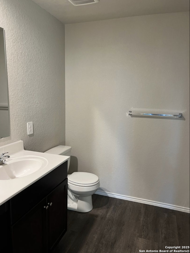 4215 Asher Alley St. Hedwig, TX 78152 - Photo 11 of 21 a bathroom with a sink and a toilet