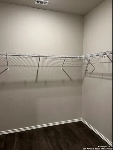 a view of a room with racks on the wall