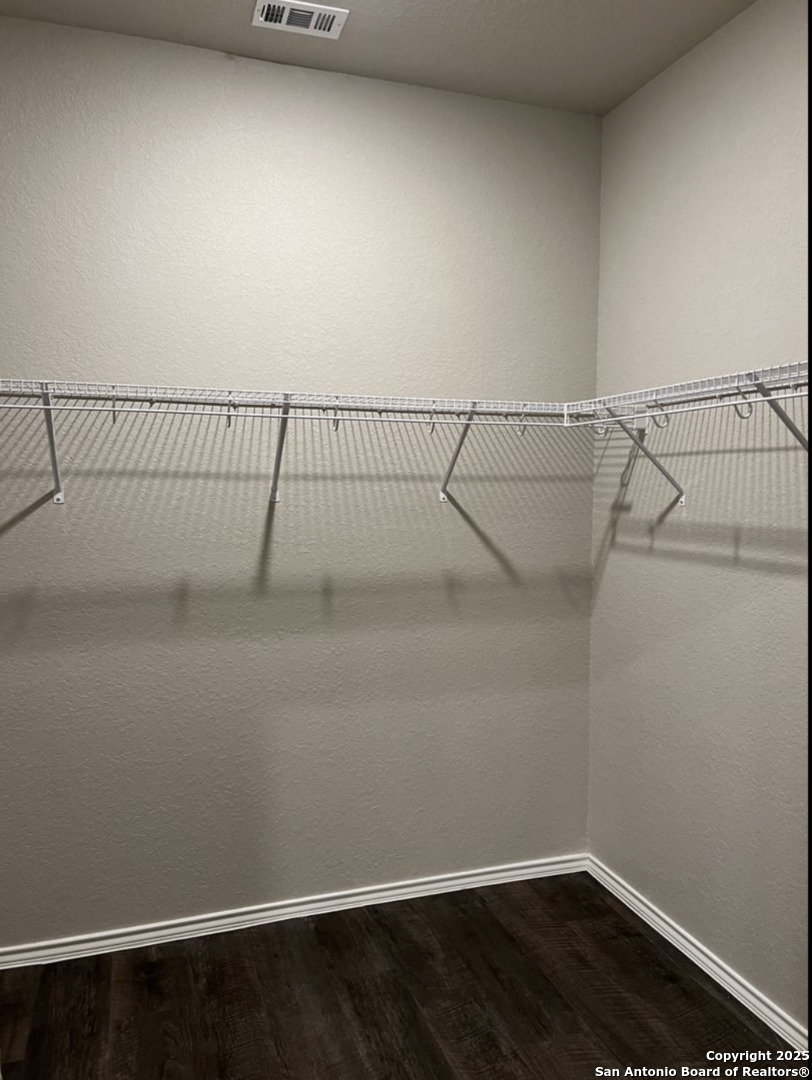 4215 Asher Alley St. Hedwig, TX 78152 - Photo 12 of 21 a view of a room with racks on the wall