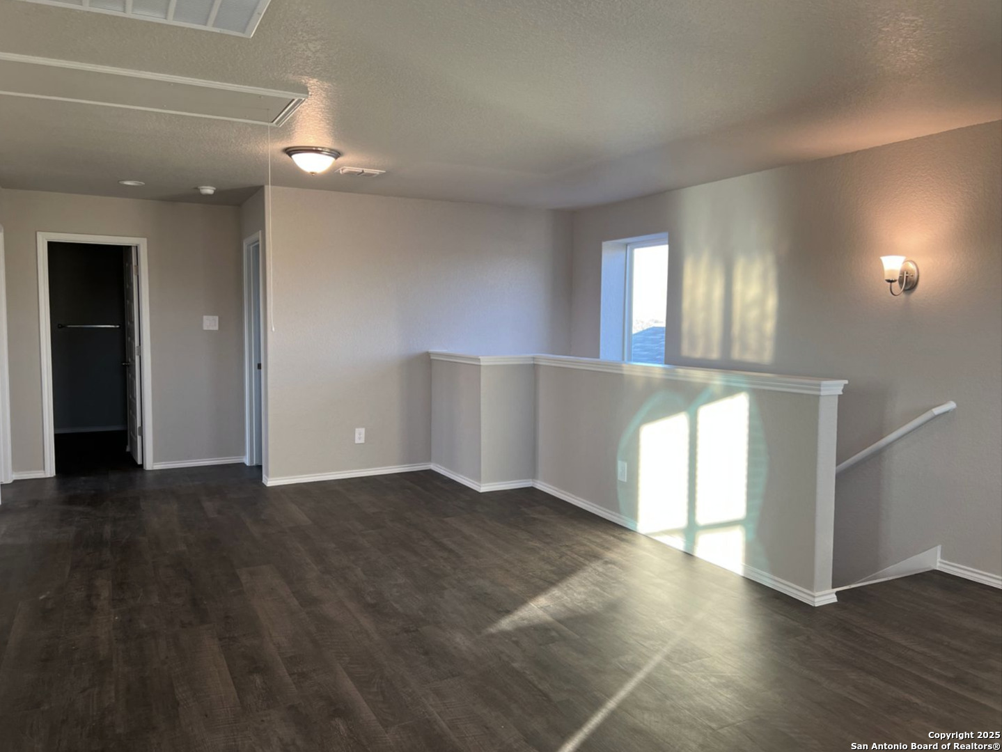 4215 Asher Alley St. Hedwig, TX 78152 - Photo 6 of 21 an empty room with wooden floor and windows