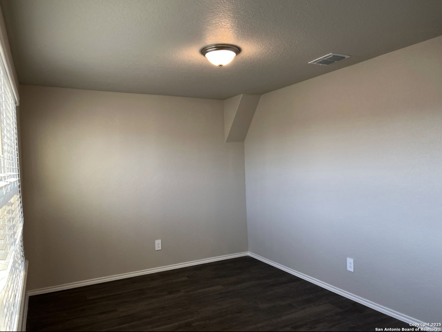 4215 Asher Alley St. Hedwig, TX 78152 - Photo 7 of 21 an empty room with wooden floor and windows