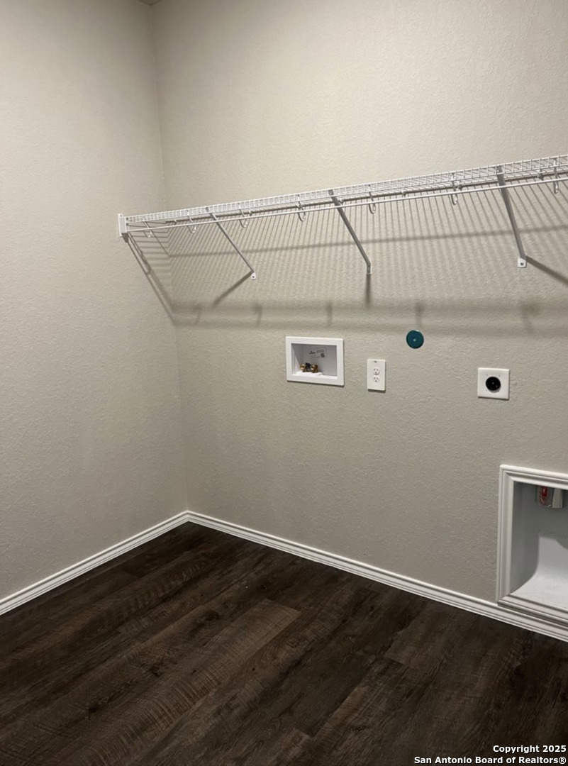 4215 Asher Alley St. Hedwig, TX 78152 - Photo 10 of 21 a view of a hallway with wooden floor and cabinet