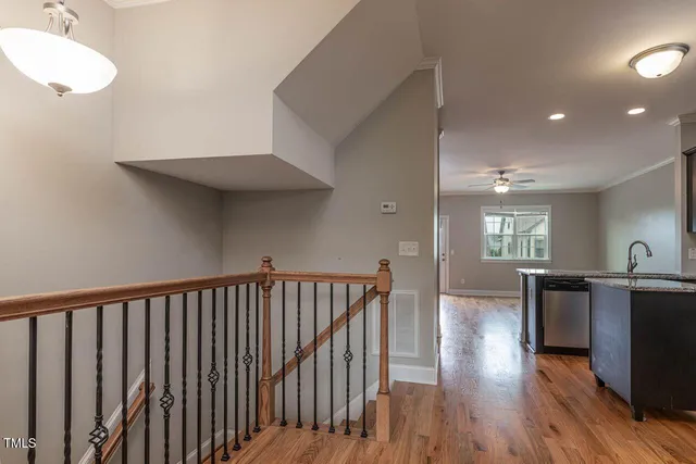 a view of kitchen with furniture and wooden floor