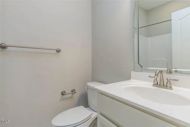 a bathroom with a sink toilet and vanity