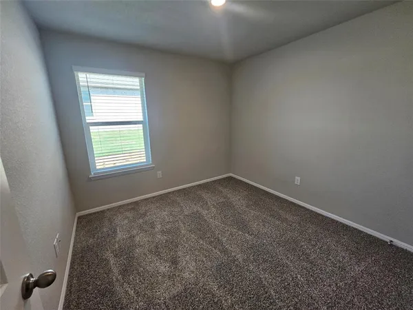 a view of a bathroom from a hallway
