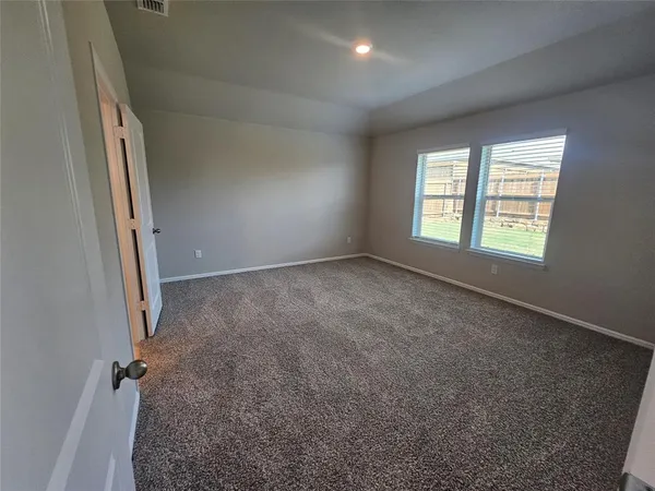 a bathroom with a double vanity sink and mirror