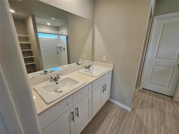 a white toilet sitting next to a shower