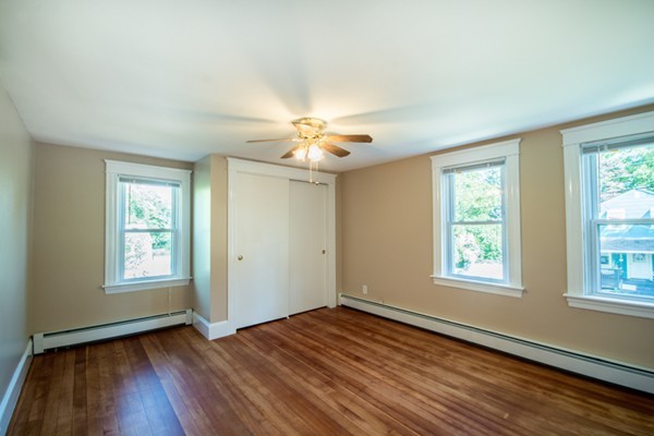 44 Bridge Street Warren, RI 02885 - Photo 11 of 30 a view of an empty room with wooden floor and a window