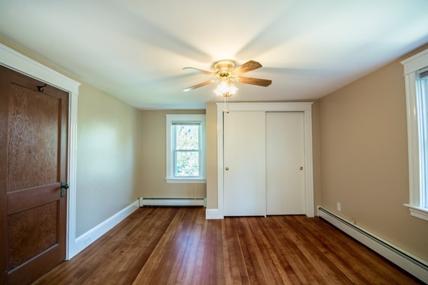 44 Bridge Street Warren, RI 02885 - Photo 12 of 30 a view of an empty room with window and wooden floor