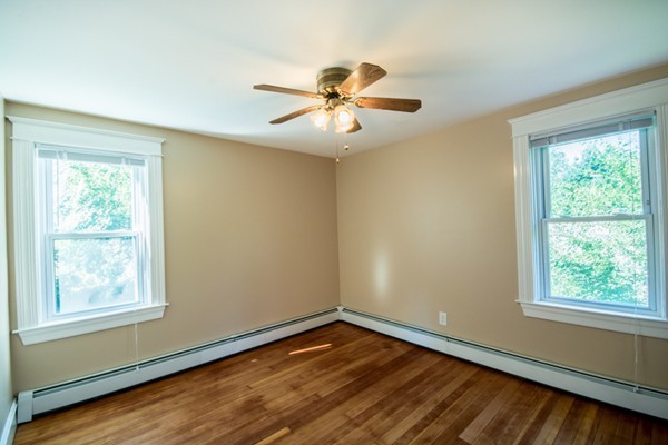 44 Bridge Street Warren, RI 02885 - Photo 14 of 30 a view of an empty room with wooden floor and a window