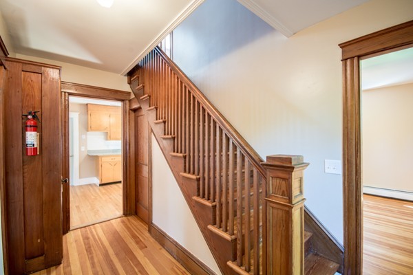 44 Bridge Street Warren, RI 02885 - Photo 18 of 30 a view of staircase with wooden floor and chair