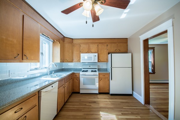 44 Bridge Street Warren, RI 02885 - Photo 19 of 30 a kitchen with a sink a refrigerator and window