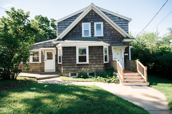 44 Bridge Street Warren, RI 02885 - Photo 2 of 30 a front view of a house with a yard